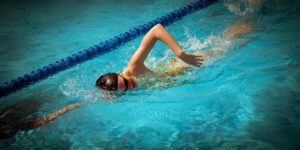 swimmer eating healthy meal poolside